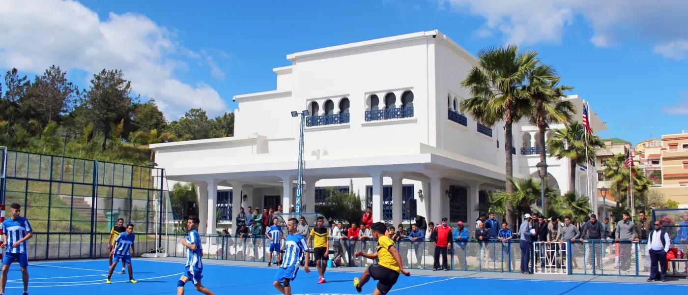 Playing soccer on UNE Tangier, Morocco Blue Sports Court